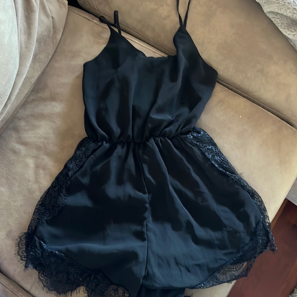 Black sheer romper with lace detail size small.. adjustable straps